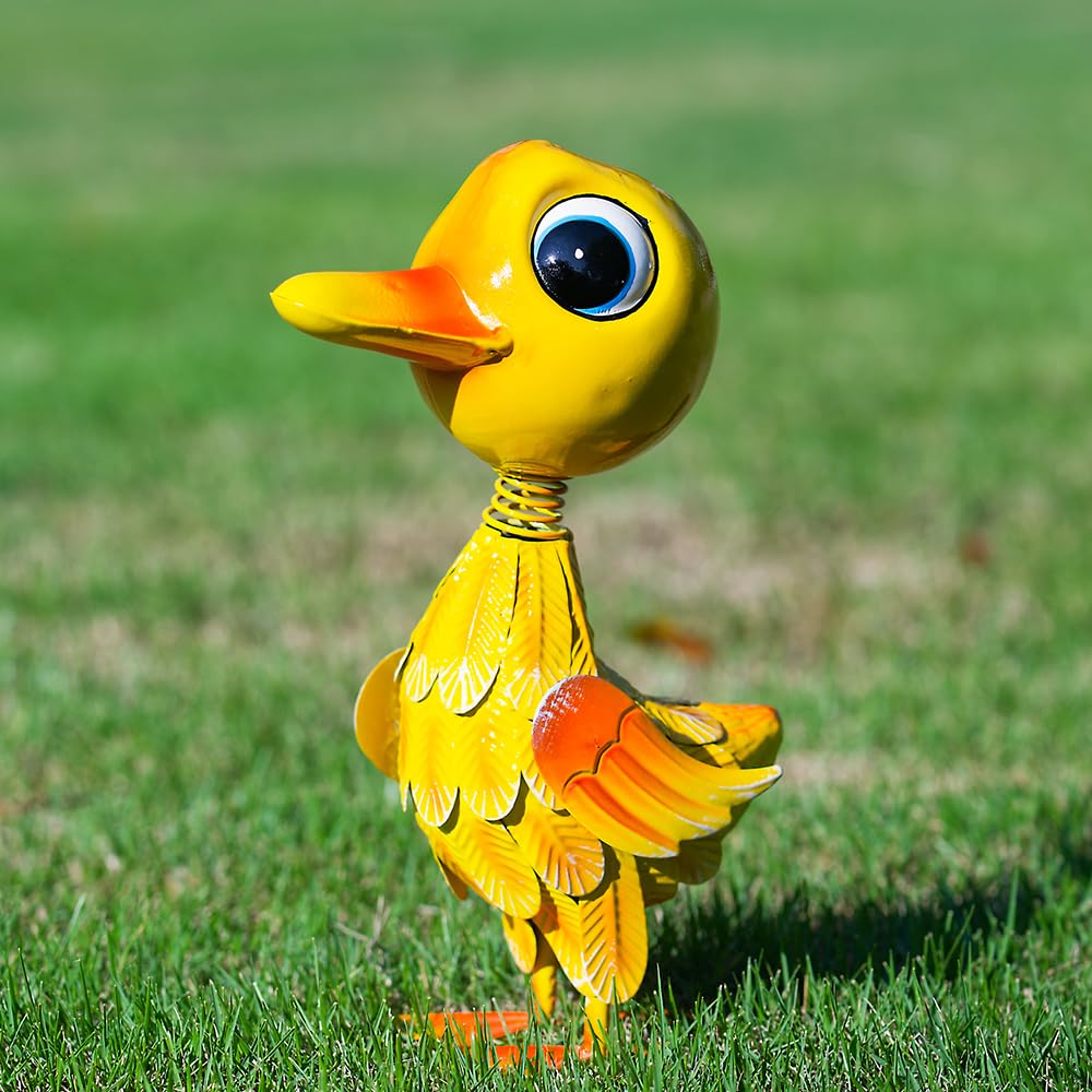 YELENEW yellow duck garden statue gleams in sunlight, adding whimsical curb appeal.