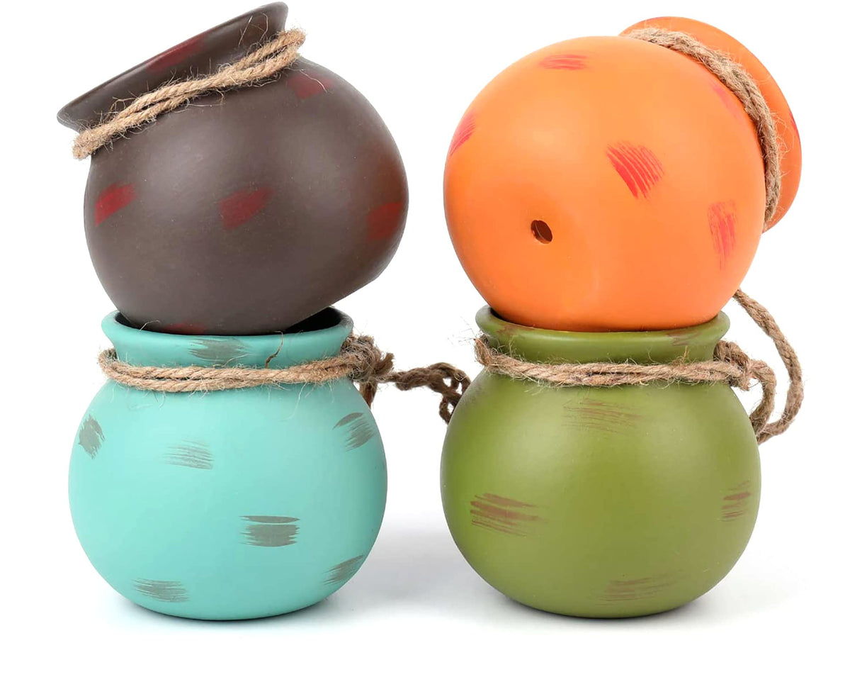 Yesland ceramic hanging mini planter in orange, adds vibrant color to shelves.