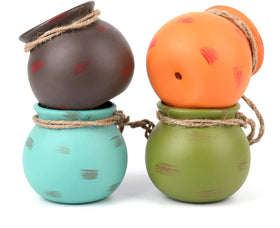 Yesland ceramic hanging mini planter in orange, adds vibrant color to shelves.