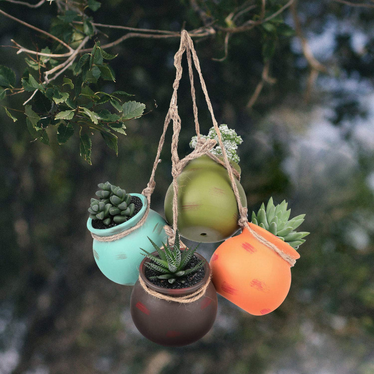 Yesland hanging ceramic planter with brown jute rope for natural wall or ceiling display.