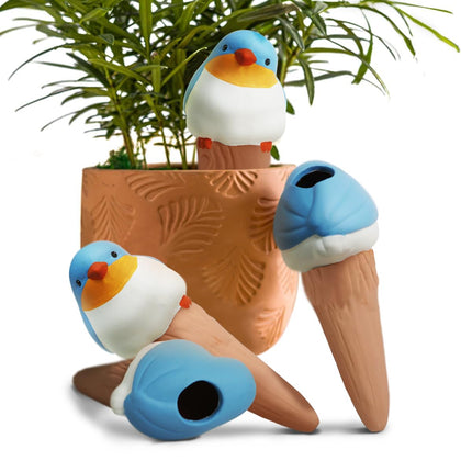 YFDB bird-shaped watering globe on a windowsill for steady moisture.
