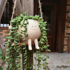 YGGlDUOl Gift-ready Swing Planter enhances homes and gardens with whimsy