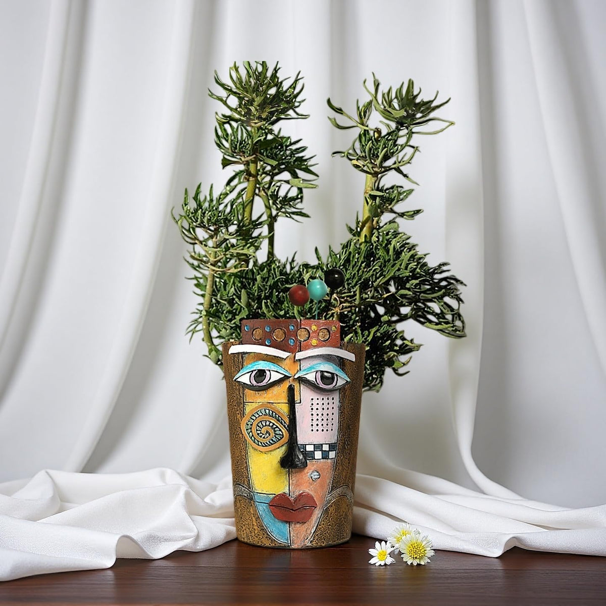 Yhupl Picasso face pot on desk adds artistic ambience to workspace