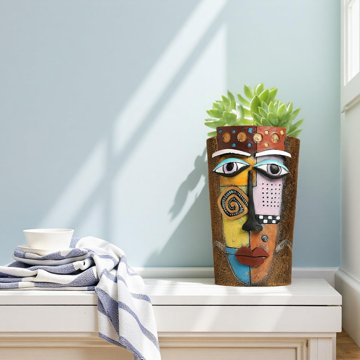 Yhupl Picasso face pot on window sill brightens shelves with color