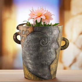 Yhupl unique art planter provides a stylish home for greenery.
