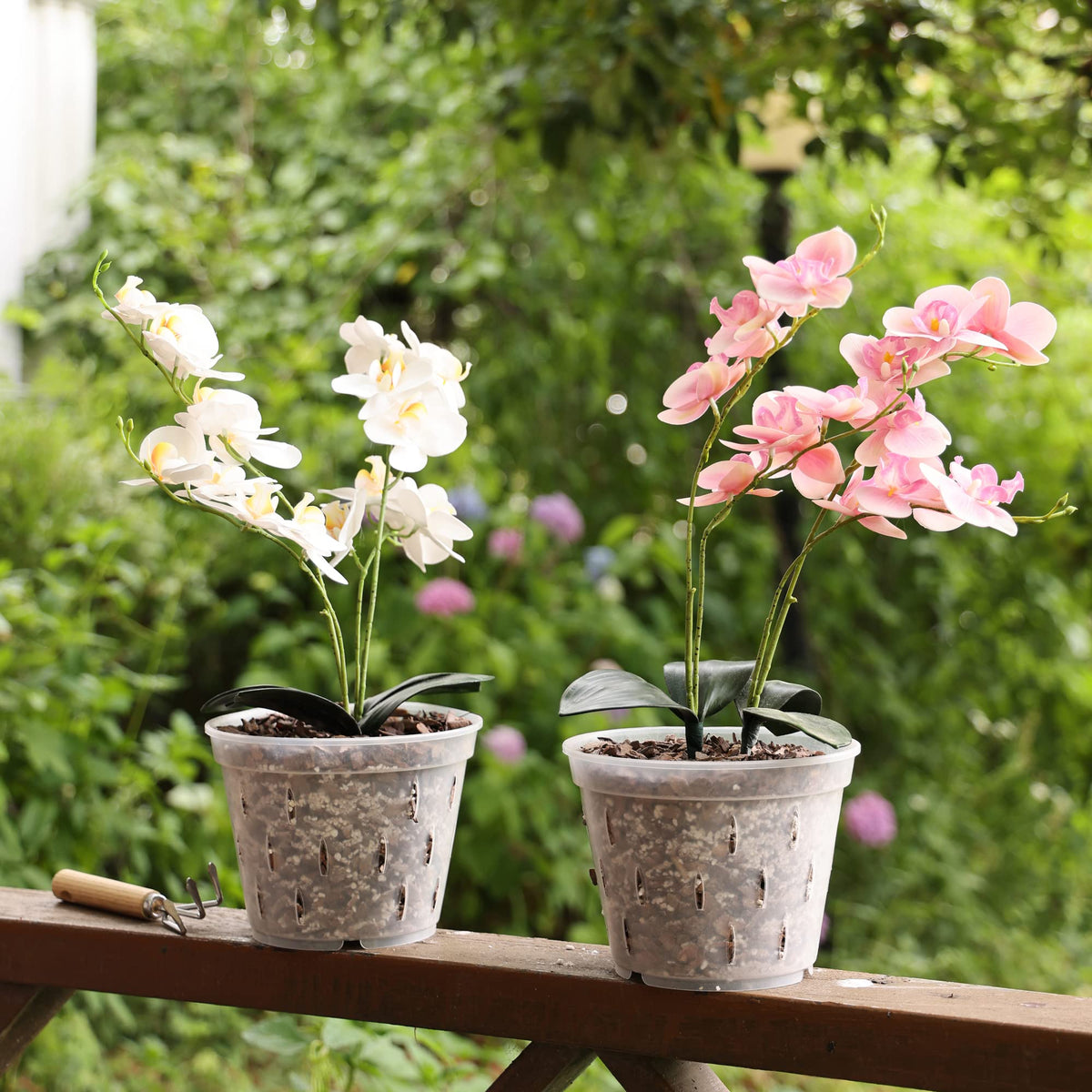 YIKUSH lightweight, durable plastic orchid pot for easy handling.