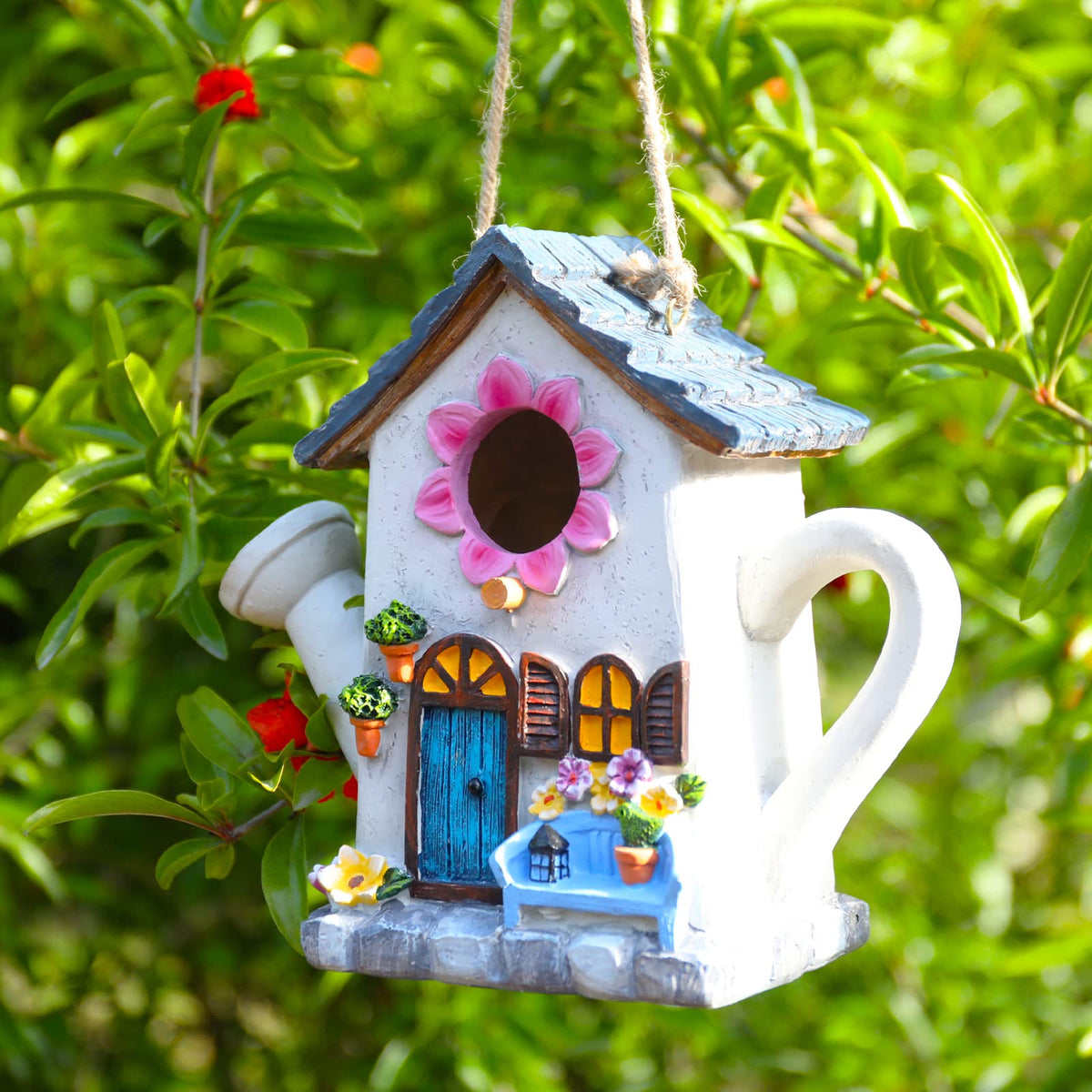 Yinns Bird House with watering can motif adds garden charm