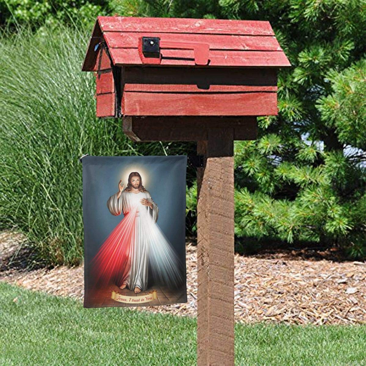 YISHOW Divine Mercy flag in garden setting with vibrant print.