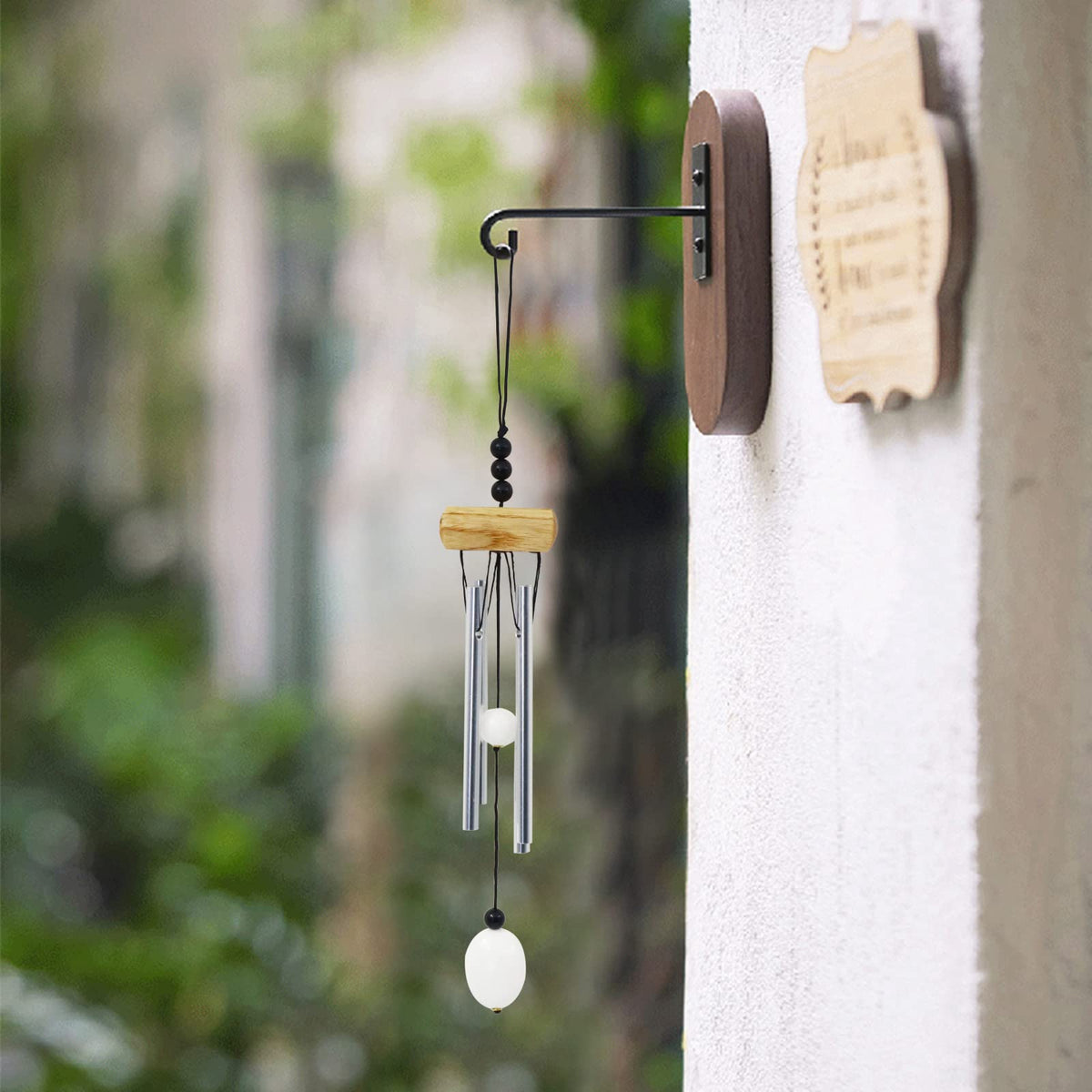 Yitexin wind chimes hanging outdoors on a wall or tree