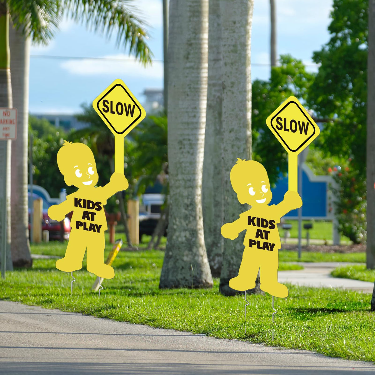 YLOLUL Kids at Play and Slow Down signs encourage safer play