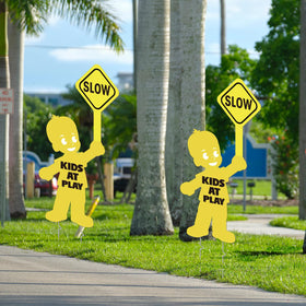 YLOLUL Kids at Play and Slow Down signs encourage safer play