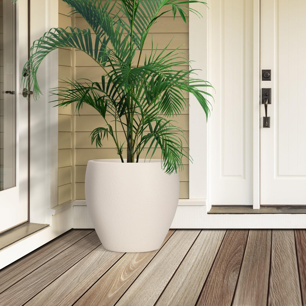 YNNICO planter with built-in tray to catch excess water and protect floors.