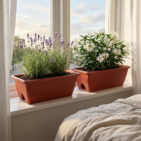 Yokodaza smooth-surface pots are easy to clean after gardening tasks.