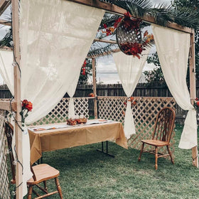 Youleyar waterproof porch curtains protect furniture from rain and sun.