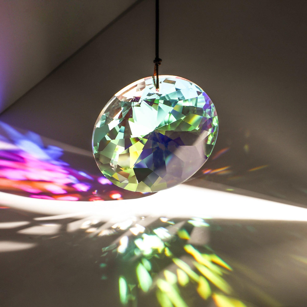 YU FENG AB-color prism displays rainbow reflections in sunlight.