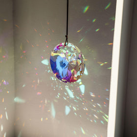 YU FENG car rearview suncatcher adds sparkle on the go.