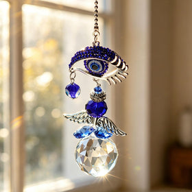 YU FENG blue evil eye suncatcher crystal angel detail glimmers in sunlight.