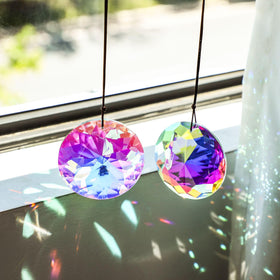 YU FENG crystal prism with brown rope hanger for versatile decor.