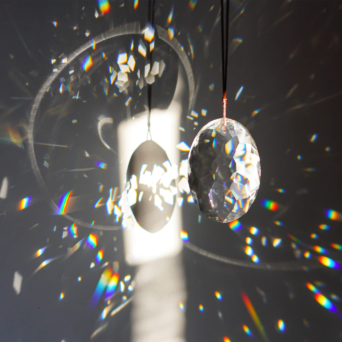Closeup facets of YU FENG prism scatter light into sparkling prisms