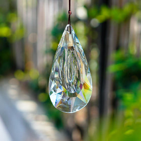 Yu Feng hanging ornament brings tree or plant accents with light.