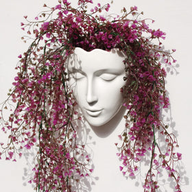 Yuccasly face vase wall hanging adds elegant ceramic art to your living room.