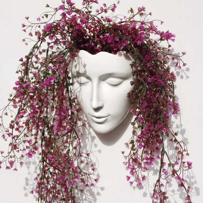 Yuccasly face vase wall hanging adds elegant ceramic art to your living room.