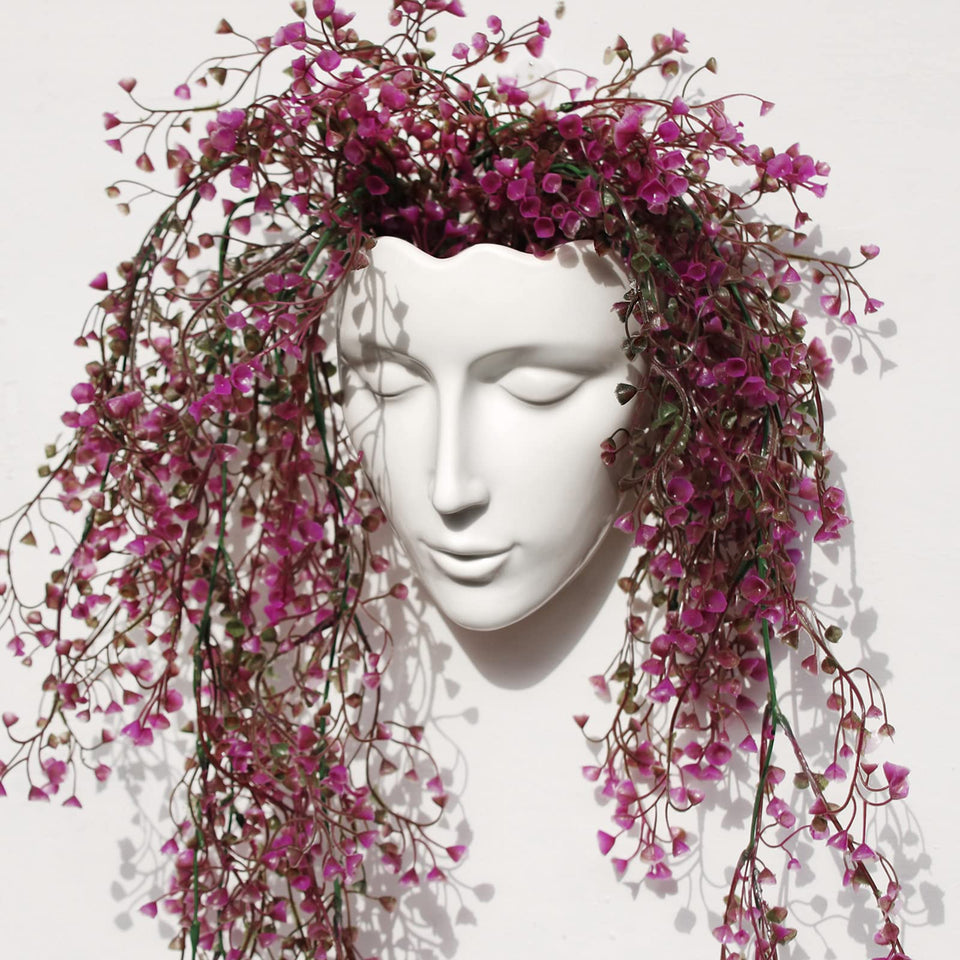 Yuccasly face vase wall hanging adds elegant ceramic art to your living room.