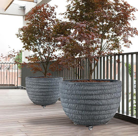 YUjieSTC black aluminum plant dolly adds modern style and stability.