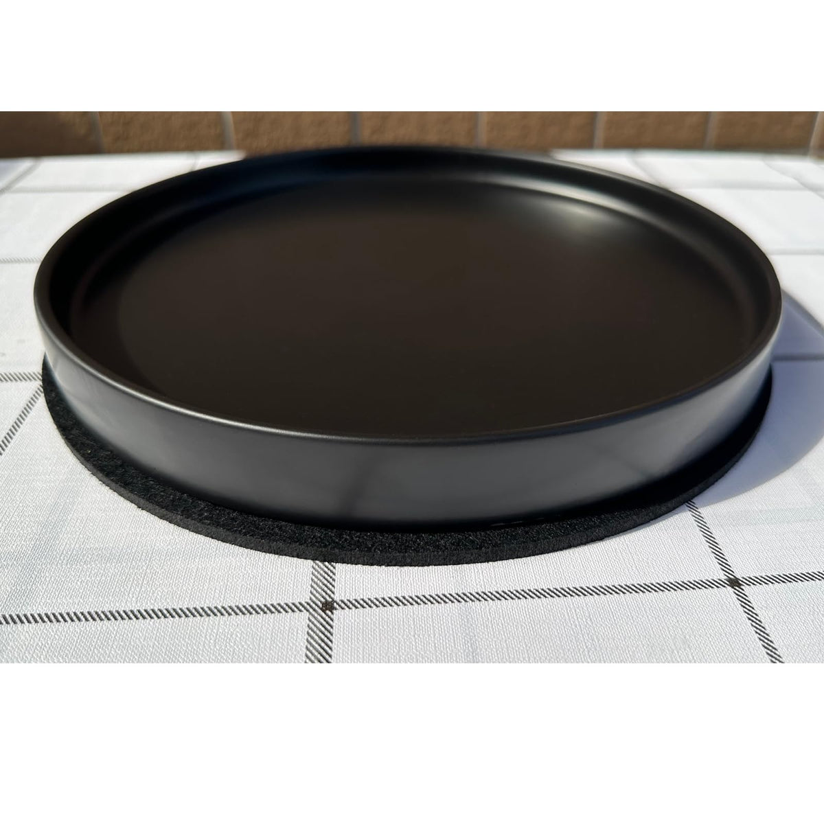 Yukfona saucers stacked in multiple sizes show versatility to fit different pot bottoms