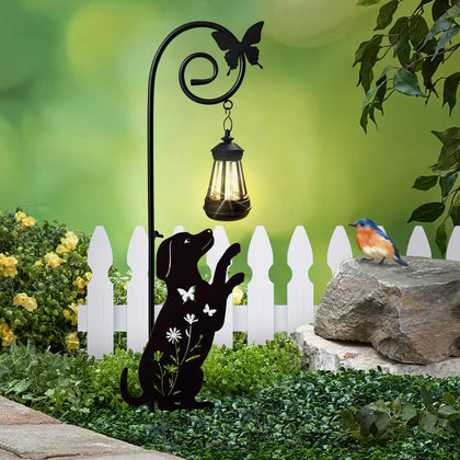 YY Gardenia metal dog stake with solar lights illuminates garden paths at night.