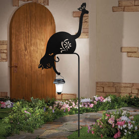 YY-Ladybug cat holding solar lantern stake shown along a pathway with soft light