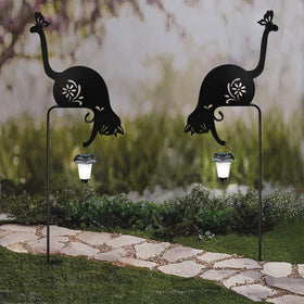 YY-Ladybug cat holding solar lantern stake close-up of weather-ready metal finish