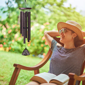 ZANIION wind chime in garden setting adds tranquil outdoor ambiance.