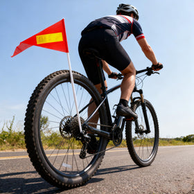 High-visibility orange-yellow flag improves group riding safety.