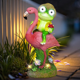 ZFNN solar garden statue: frog-on-flamingo glows at night for garden charm.