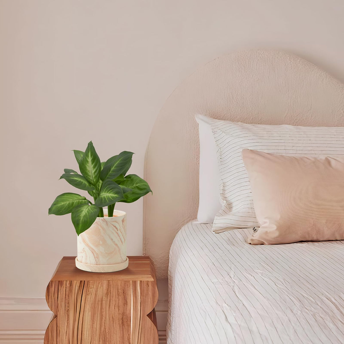 ZICZAMLA pink painted terracotta pot adds modern color to interiors.