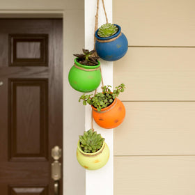 Zingz & Thingz terracotta planters feature braided rope detail for vintage-style display.