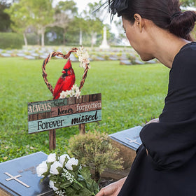 Zonon Cardinal grave stake on a lawn garden setting for memorial display