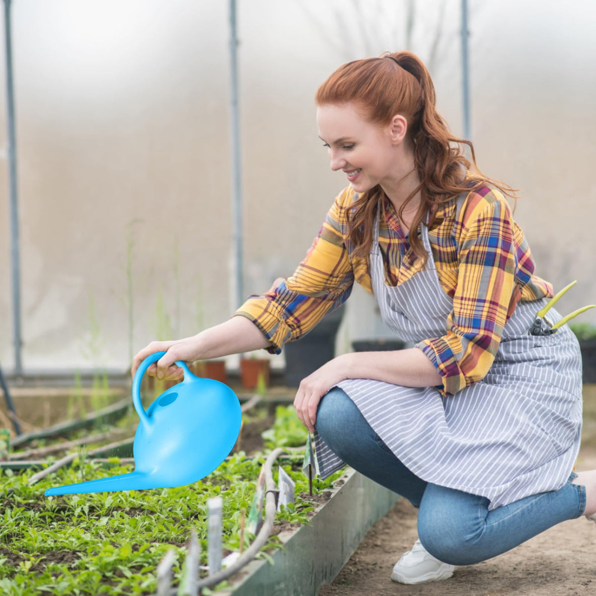 ZXJ blue watering can adds decorative touch to home or garden