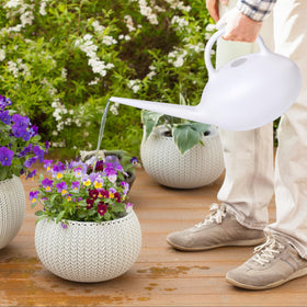 ZXJ small watering can in garden setting white offers a practical decorative option