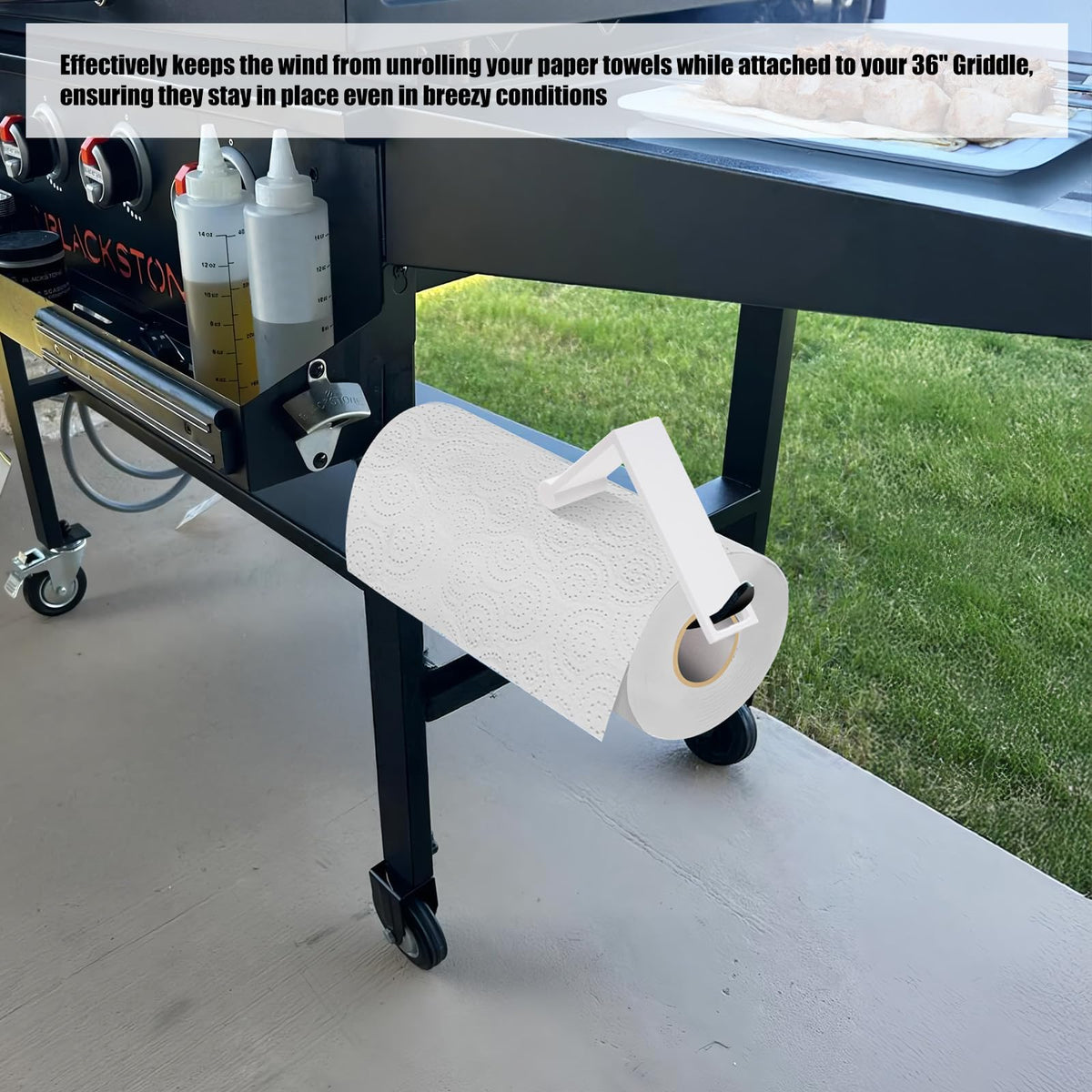 Zynoro white wind guard attached to towel holder for breezy outdoor cooking